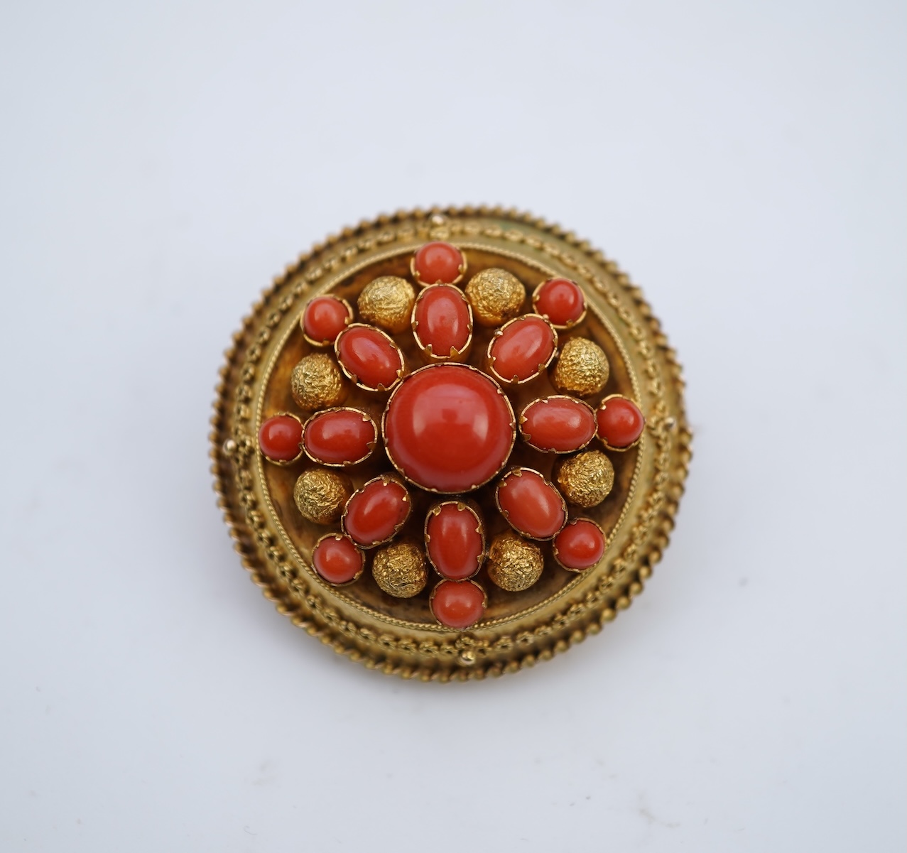 A Victorian gold and coral brooch, late 19th century